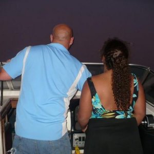 Me teaching Katie to pilot the boat