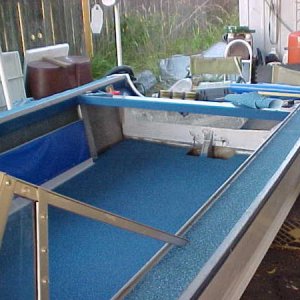 MVC 017S  75 16SS starting to put it back together.  Nautlux on floot and top side rails  may do the bow later