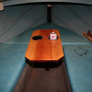 As far as I know the cuddy's on the Starchiefs had no tables.  Here's my "removable" table in place with refreshment.