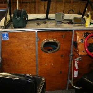 added port hole window to door to spy on wife when it's cold and she has the door closed to keep warm.