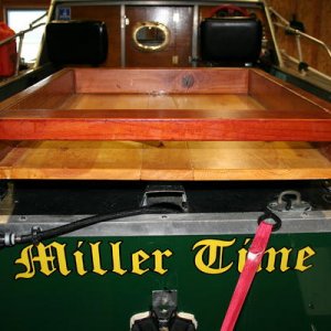 station extends over transom slightly and it's open for hosing or flushing.  Rear crossing 2x4 is to save my tacklebox when I haul a$$ somewhere and f