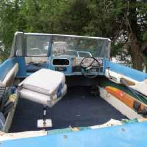 view from the rear over the engine hatch . As you can see no drivers seat , want to find OEM seating to go back into this boat.