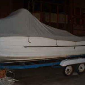 Original canvas cover was never removed to take pics. I could tell from silhoute that it was a Starchief cabin boat.