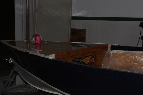 I used interlux brightside.  I sanded the old paint with 220 grit, cleaned it really well, then applied the paint.  I put it on with a 3" roller, 1/8"