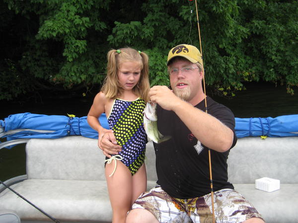me and my daughter, she cuaght that bass on a worm.. once it was in the boat, she wasnt sure what she thought of it, geode lake july 2010