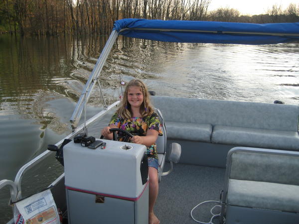 my daughter at the helm (big hollow lake, june 2010)