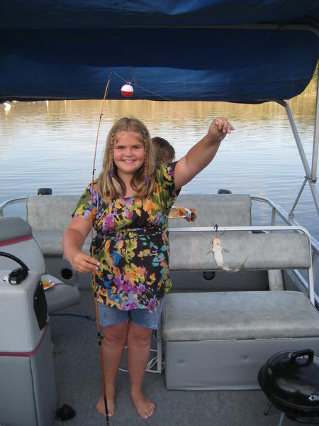 my daughter holding a small channel cat (big hollow lake 2010)