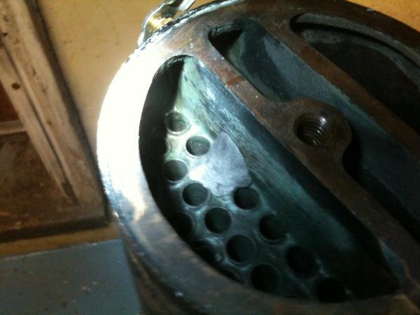 Note the plugged tube. there were two, i did both with a rubber plug pressed in the hole then used J-B stick weld to make a plug to hold that in. it h