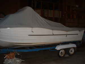 Original canvas cover was never removed to take pics. I could tell from silhoute that it was a Starchief cabin boat.