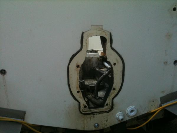 Someone tried to fix the leak with caulk from the wrong side. The two holes to the right are the live well hoses. the pump one had silicone on it and 