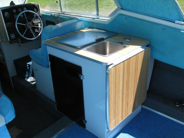 The new kitchenette with the ice box out and storage drawers put in