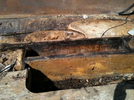 under floor, all is rotten, foam is bad.  looks like I get to learn how to make, install, and finish stringers and risers.  With this much rot I will 