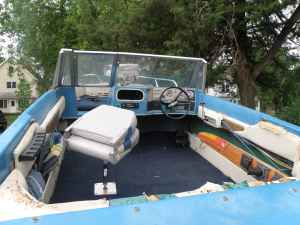 view from the rear over the engine hatch . As you can see no drivers seat , want to find OEM seating to go back into this boat.